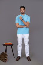 Close-up of sky blue polo shirt placket and buttons